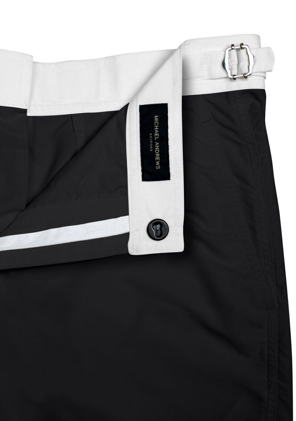 (product) Black Swim Shorts with White Waistband, close-up view