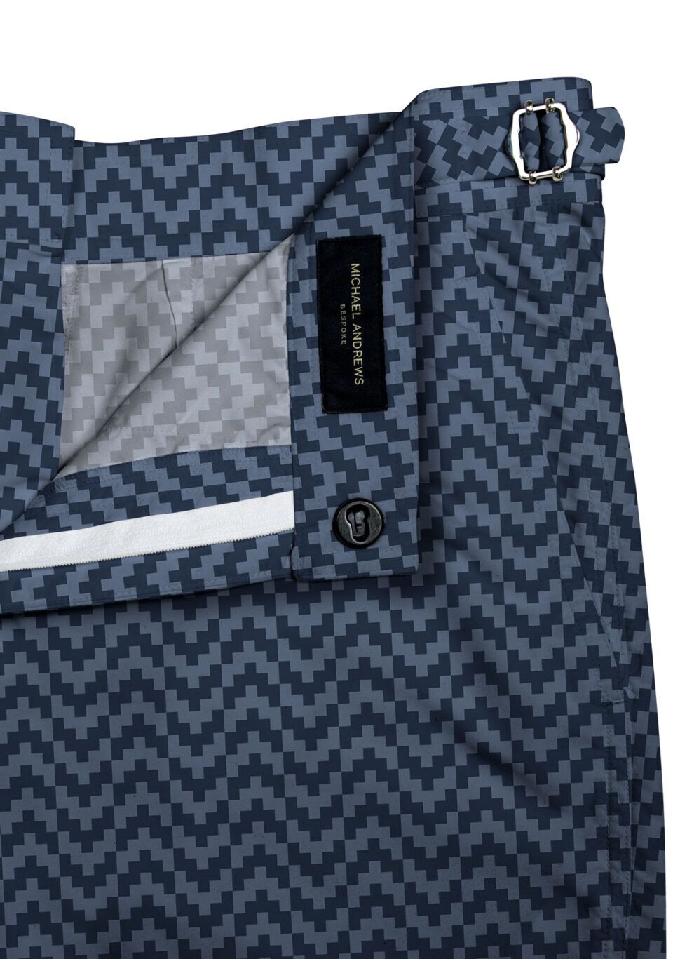 (product) Blue Zig-Zag Swim Shorts, close-up view showcasing lining and adjustable side tabs