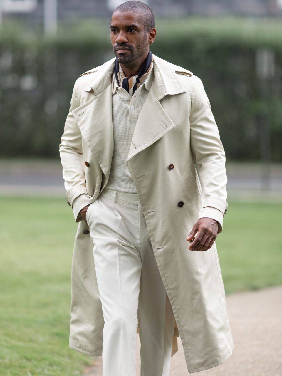 Classic Cream Cotton Trench Coat featuring double-breasted closure and epaulet detailing